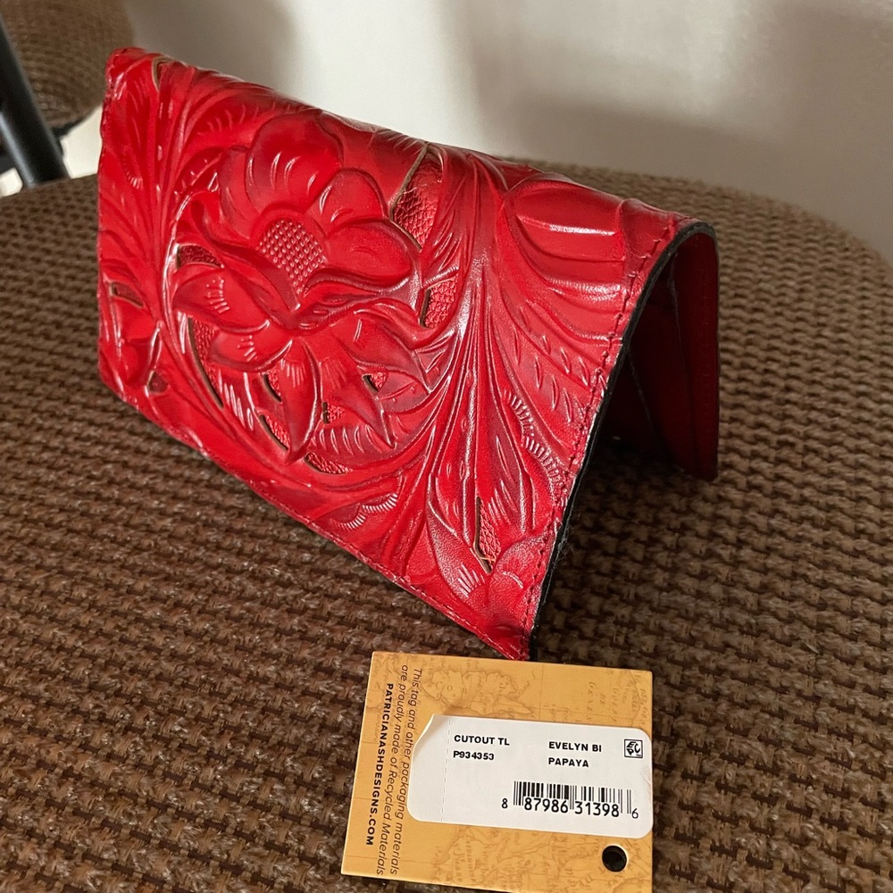 Patricia Nash wallet!! the color is papaya, which is a beautiful red.